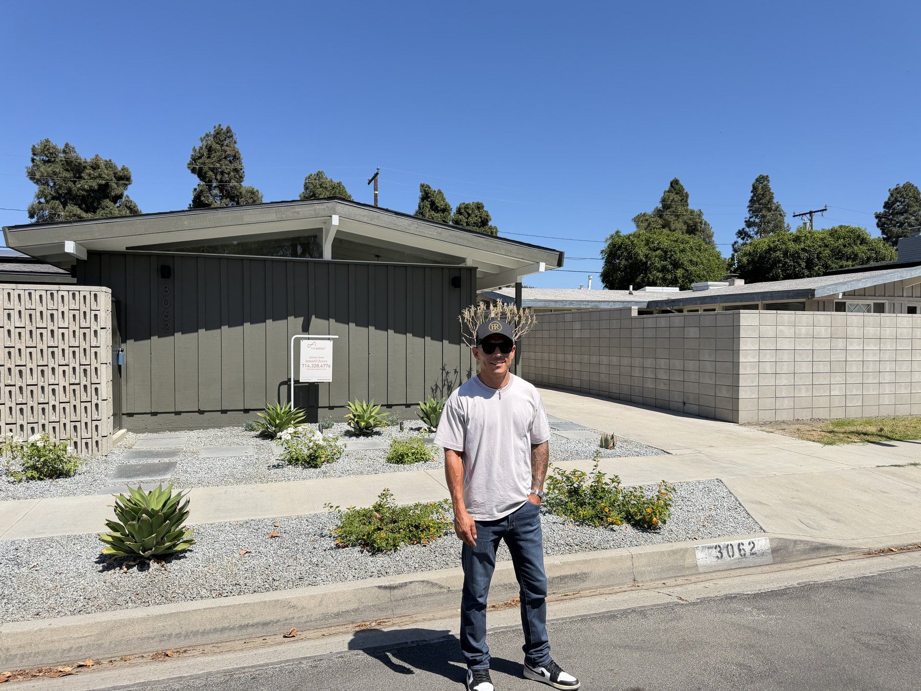 Hector M. Ruiz Jr. outside a mid-century modern listing in Long Beach