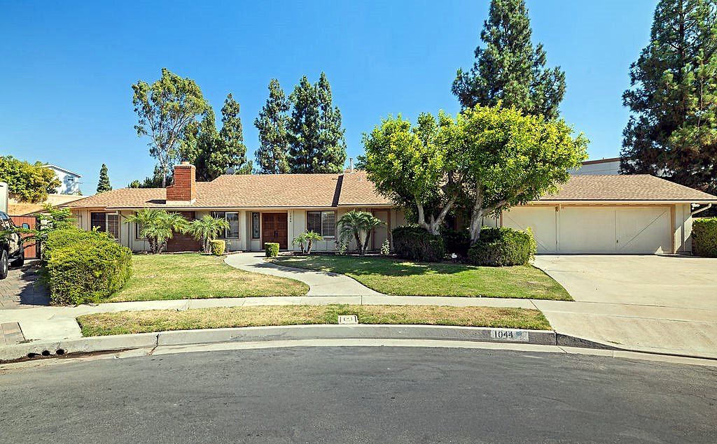 Single-story ranch home on a cul-de-sac in Placentia with a wide lawn and mature trees, sold by The Chavez Team