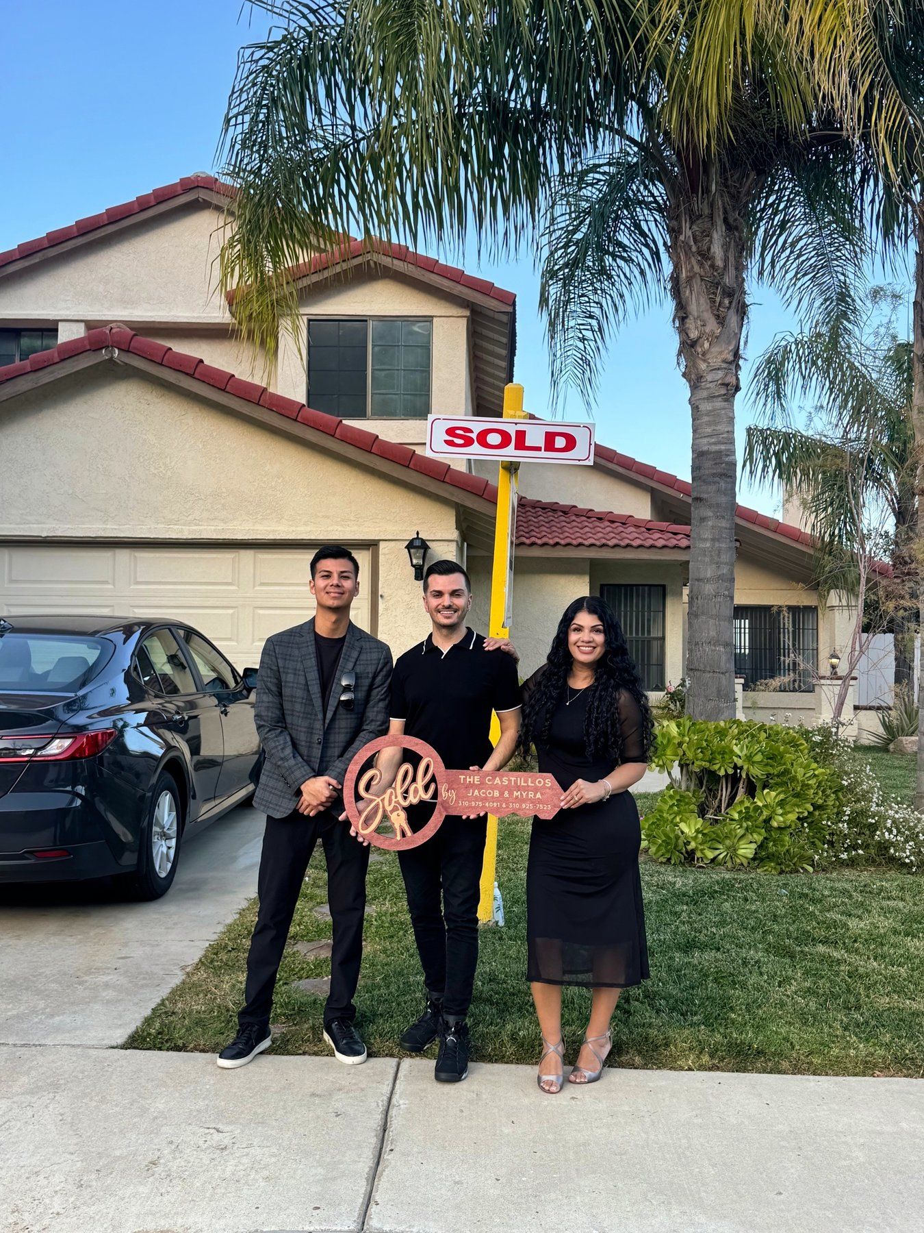 Jacob Castillo with clients outside their newly purchased home in Orange County