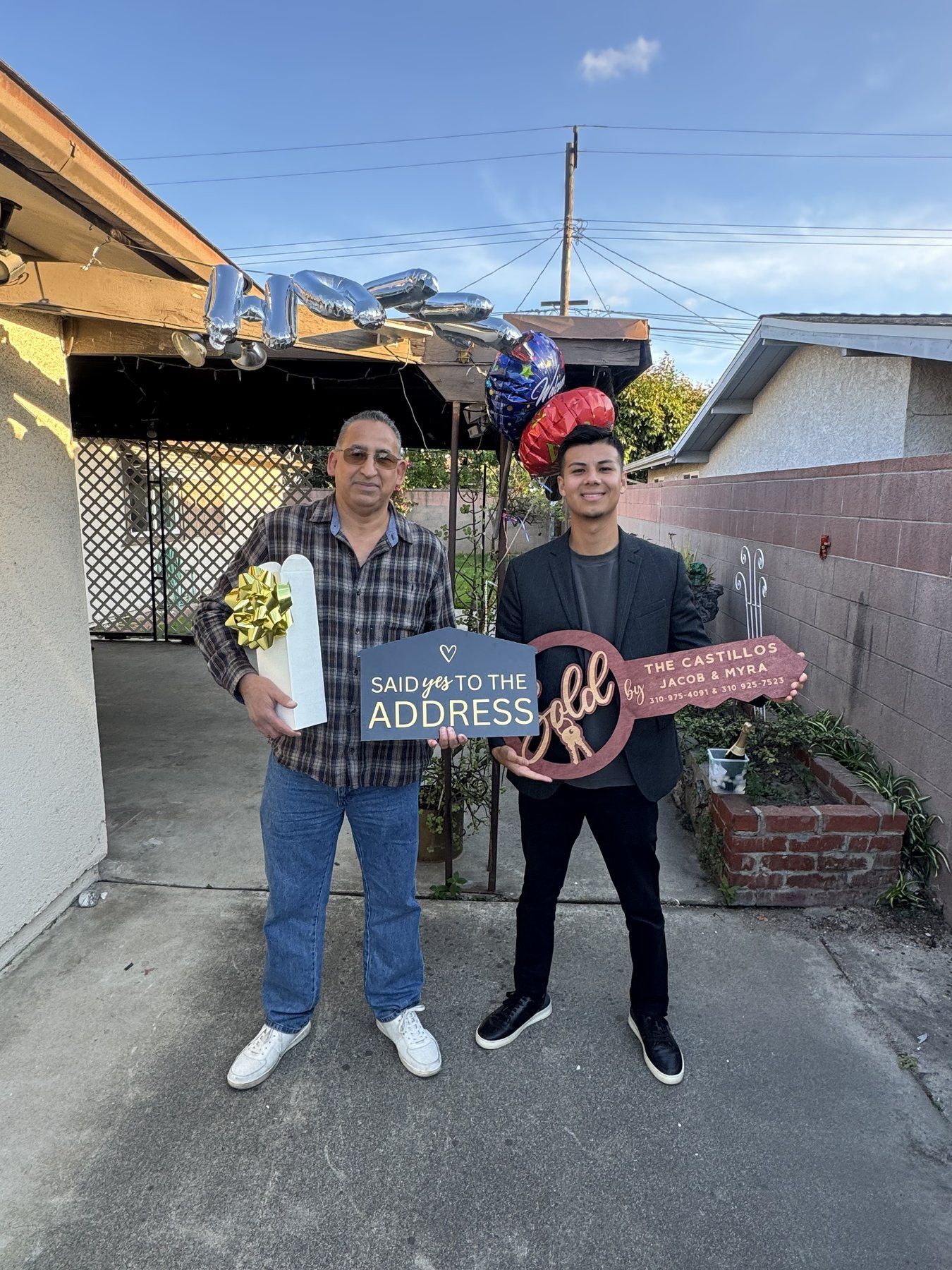 Jacob Castillo handing over the keys to a client on closing day