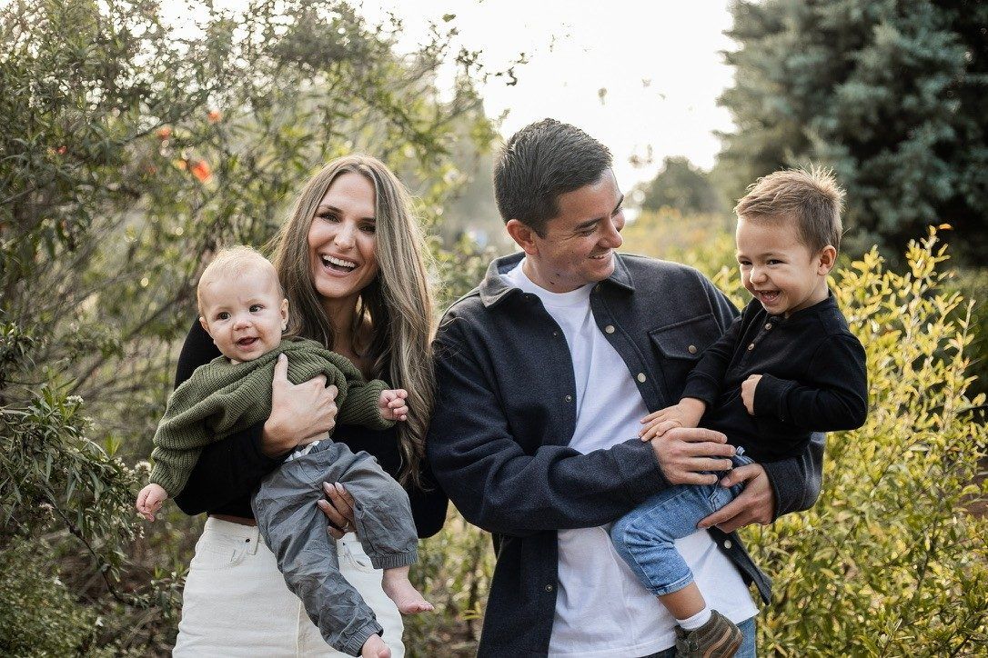 Jon Gryn with his wife Debbie, sons Nolan and Nathaniel, and Oaklie the goldendoodle at home in Cypress, California