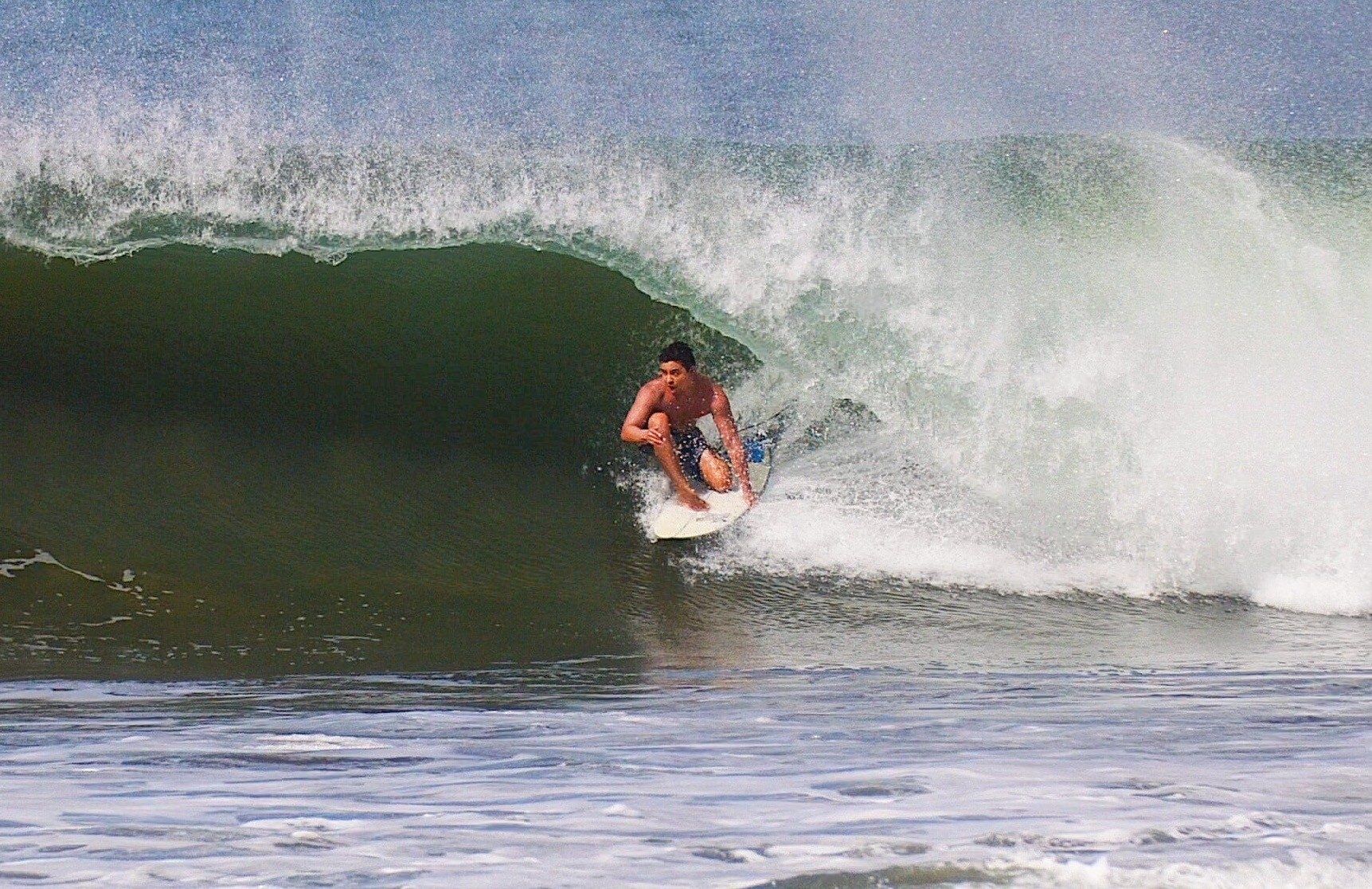 Jon Gryn with his surfboard at Seal Beach, Orange County